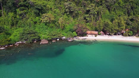 perfect aerial top view flight cabins hut in jungle