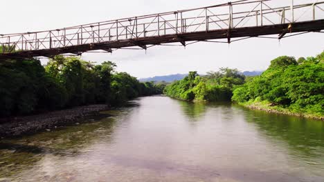 small bridge walkway over calovebora river, panama