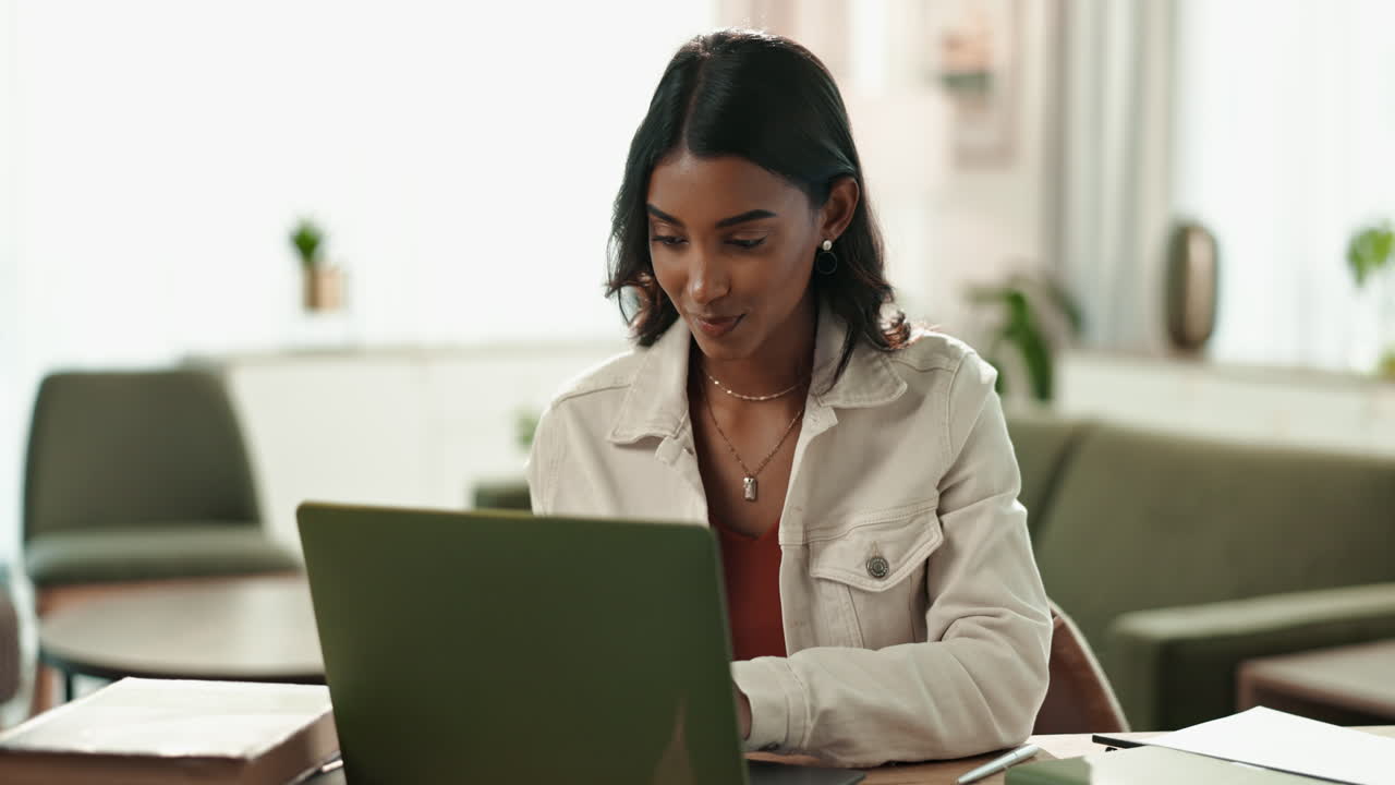 Woman working on laptop at home