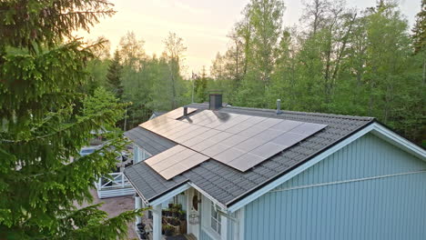 aerial view away from rooftop solar cells absorbing the last sunlight of the day