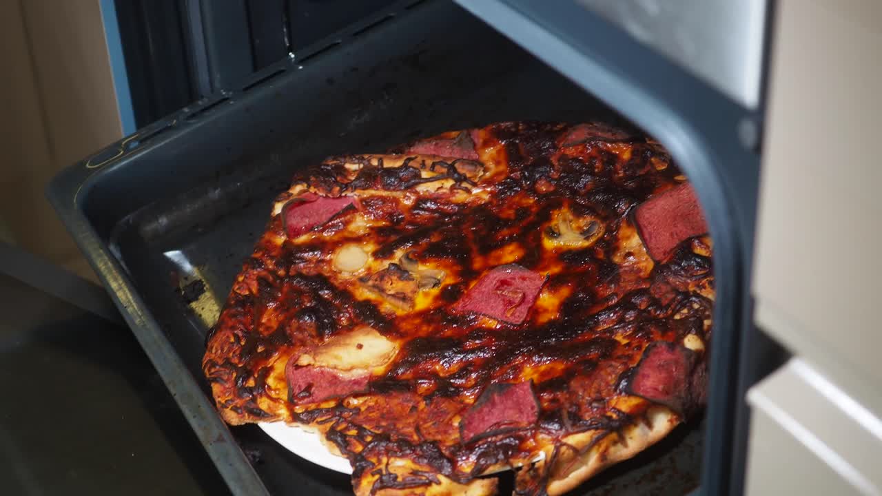 Burnt Pizza in Oven