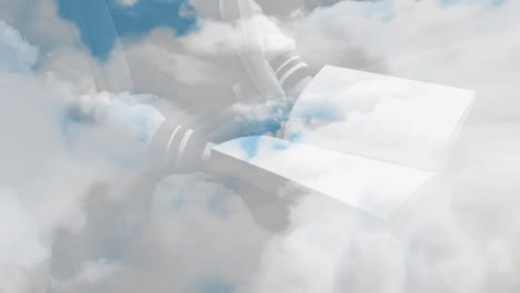animación de nubes sobre hombre sosteniendo un libro