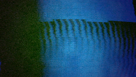 pintura abstracta con un fondo azul y negro vibrante y salpicaduras aleatorias