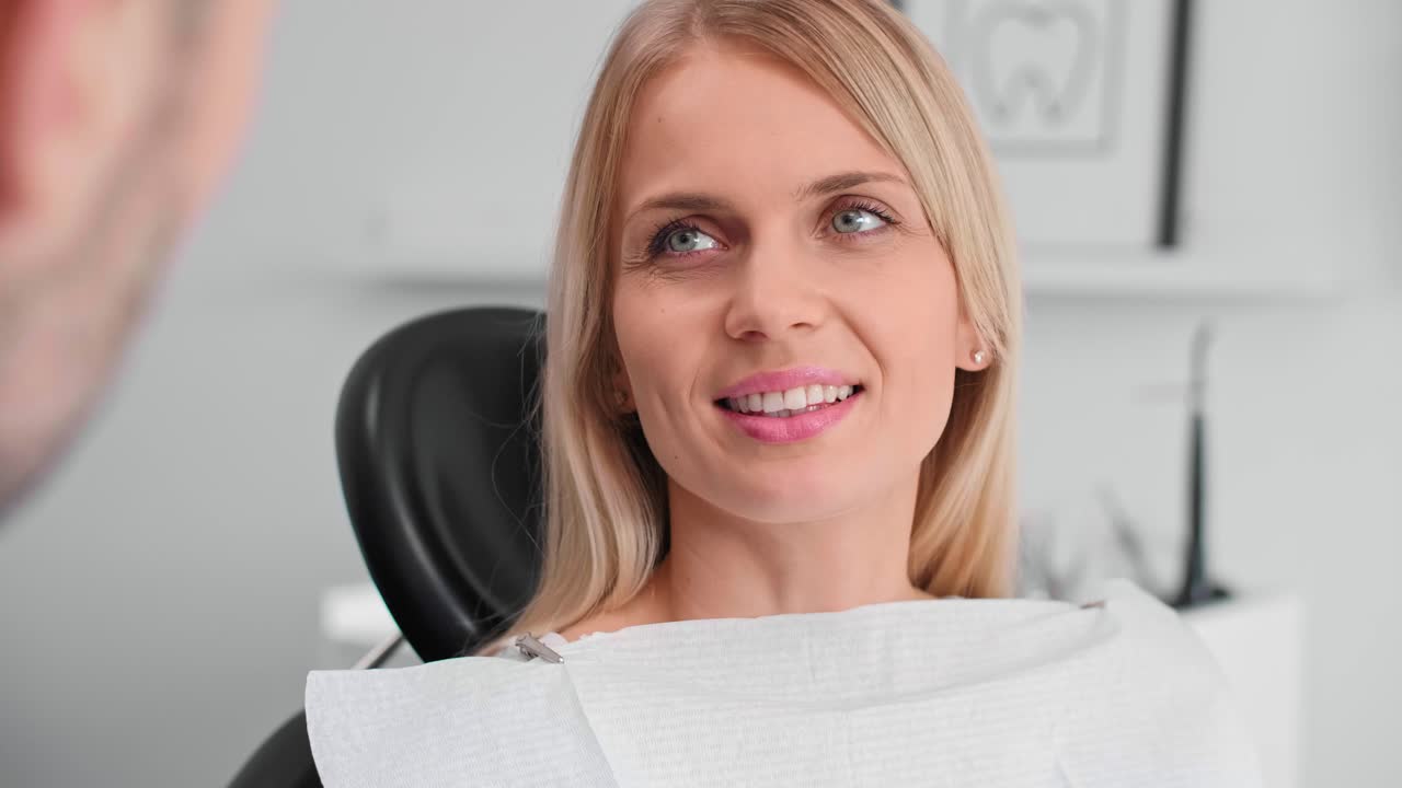 Portrait of smiling woman at the dentist's office