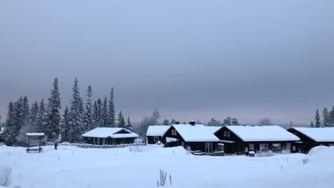 snow the roof of cabins in the village