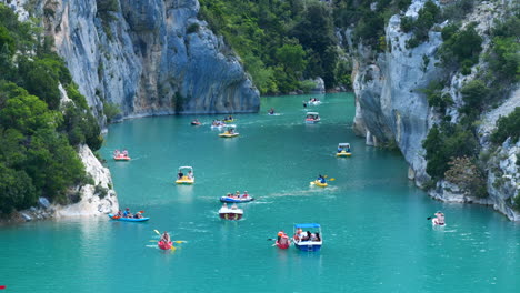 boating and kayaking on a turquoise river in a scenic canyon