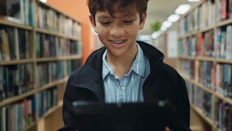 boy reading in a library