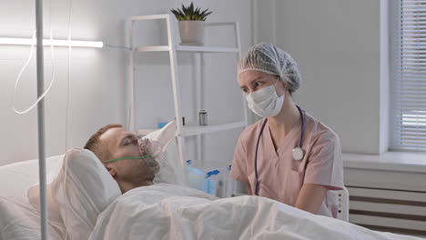 nurse talking to sleeping patient