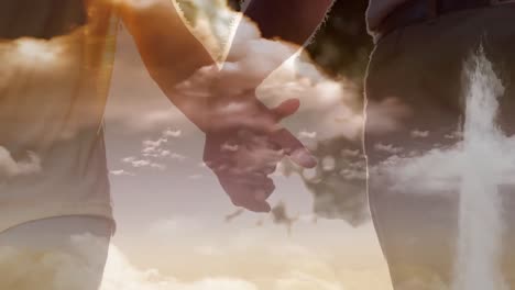 Animation-of-a-Christian-cross-over-a-couple-holding-hands-