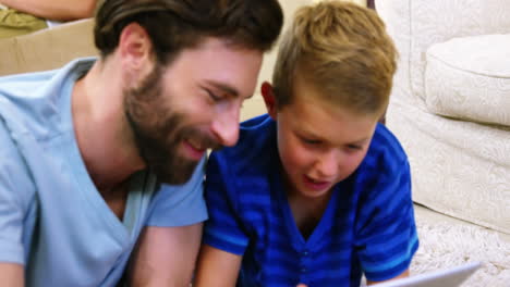 father and son using a digital tablet