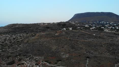 mountains covered with cretan houses at sunset
