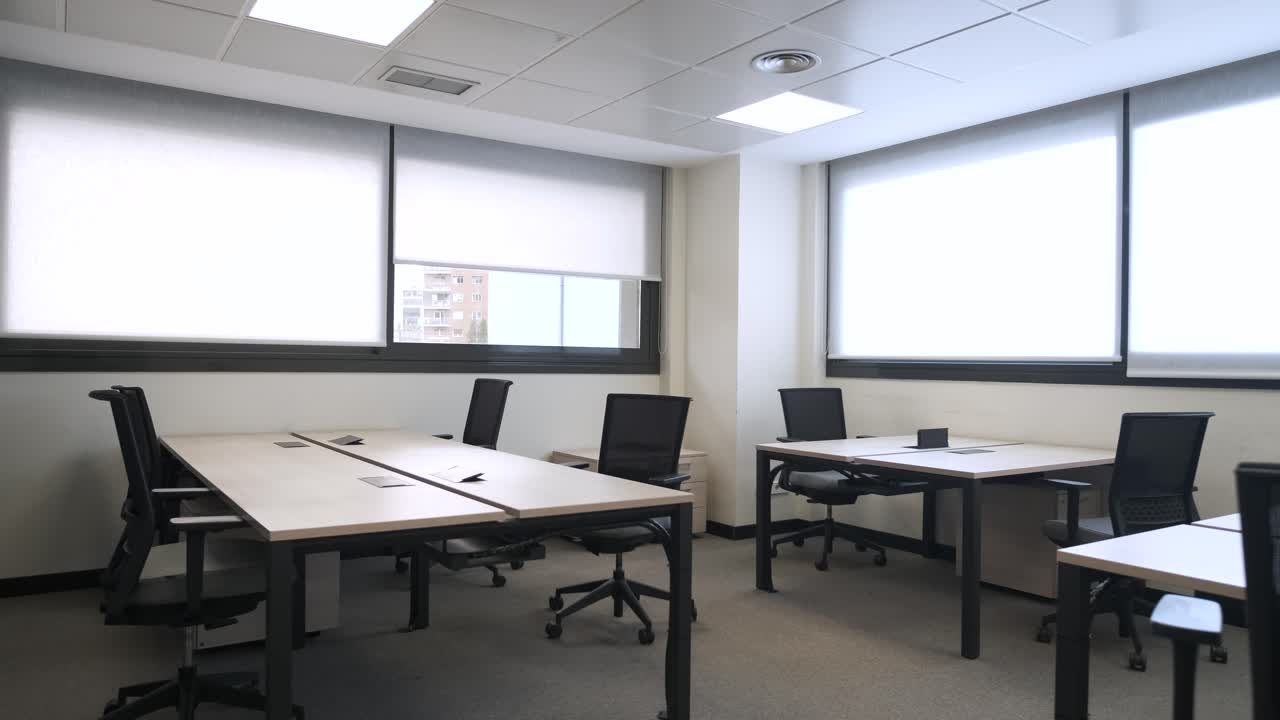 Interior of spacious office with tables and chairs
