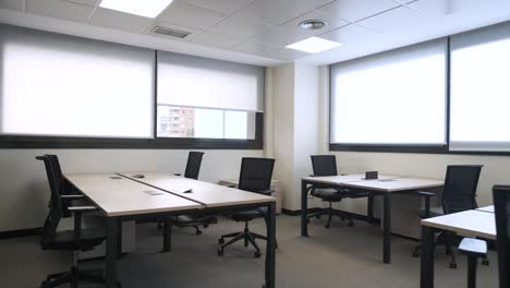 interior of spacious office with tables and chairs