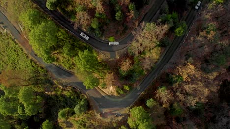 aerial top-down zoom-out shot of the highway in the hills connecting bir and the top of paragliding spot in billing, himachal pradesh, shot with a drone in 4k