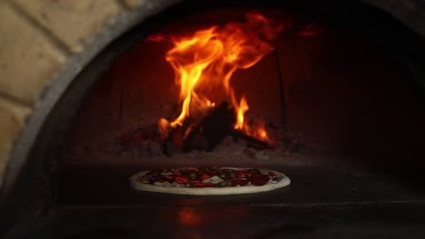 pizza baking in a wood-fired oven