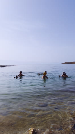 people swimming in the dead sea