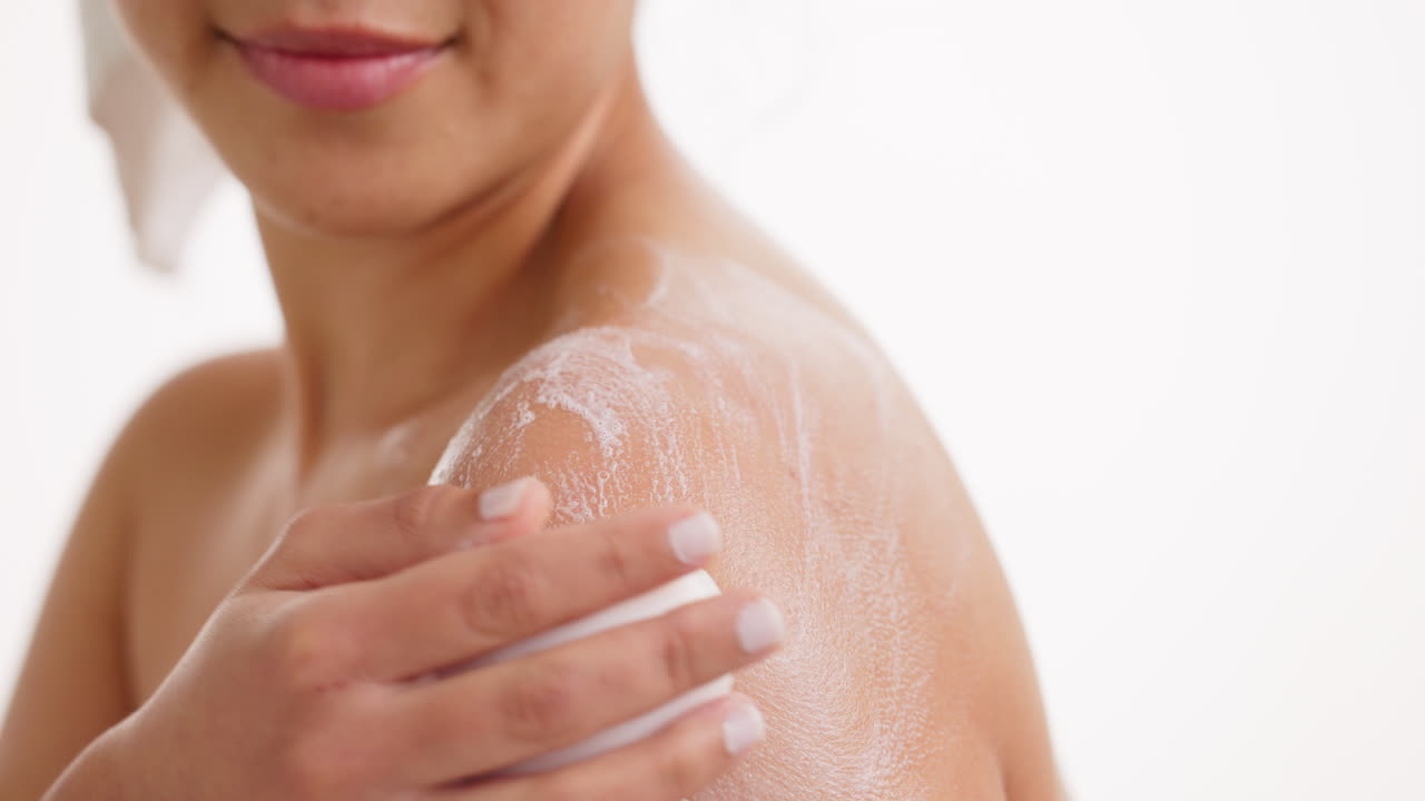 Woman Washing Body with Soap in Shower