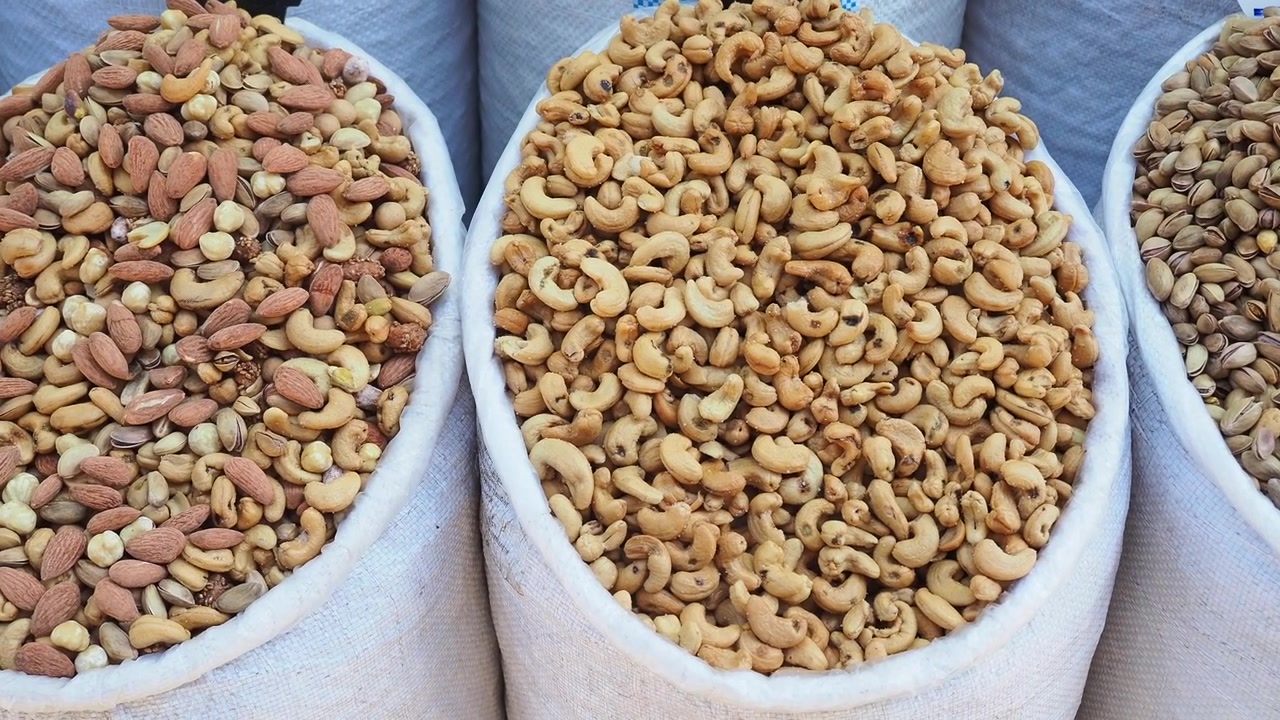 Assorted Nuts and Dried Fruits in Large White Sacks