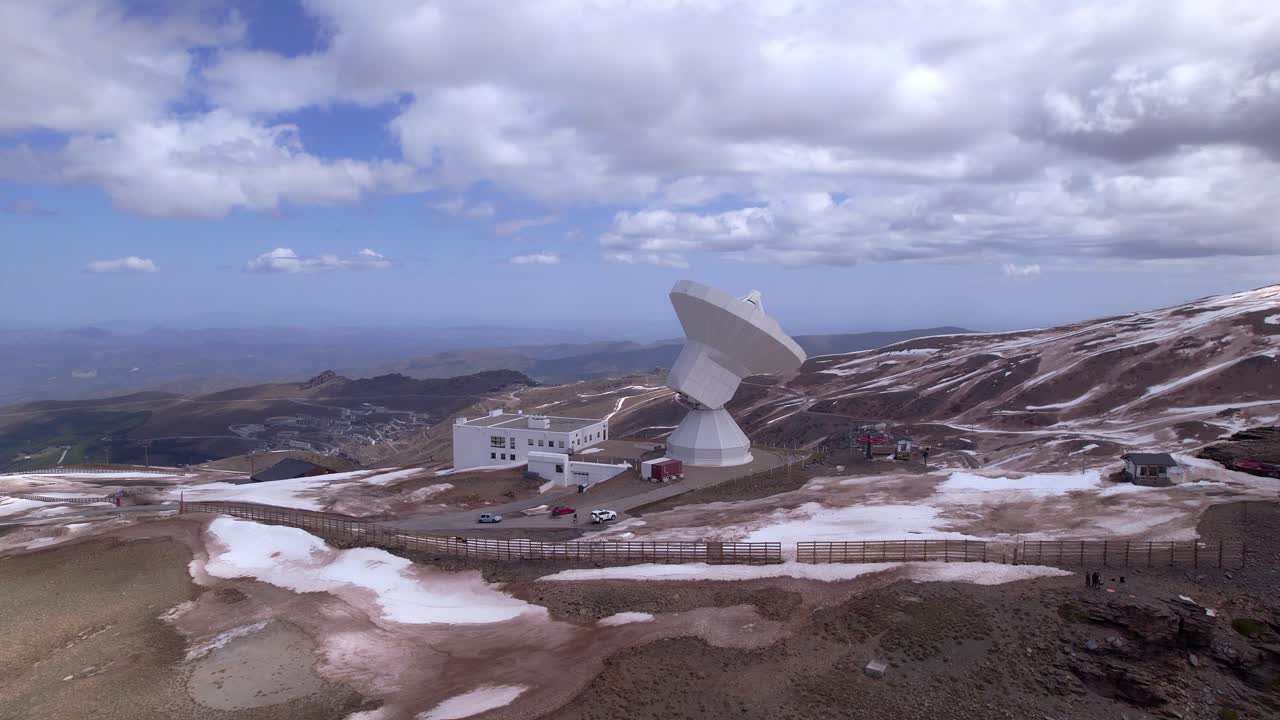Radio telescope observatory in snowy mountains. Panoramic aerial view. Telescope in high mountains. Sierra Nevada. Spain.