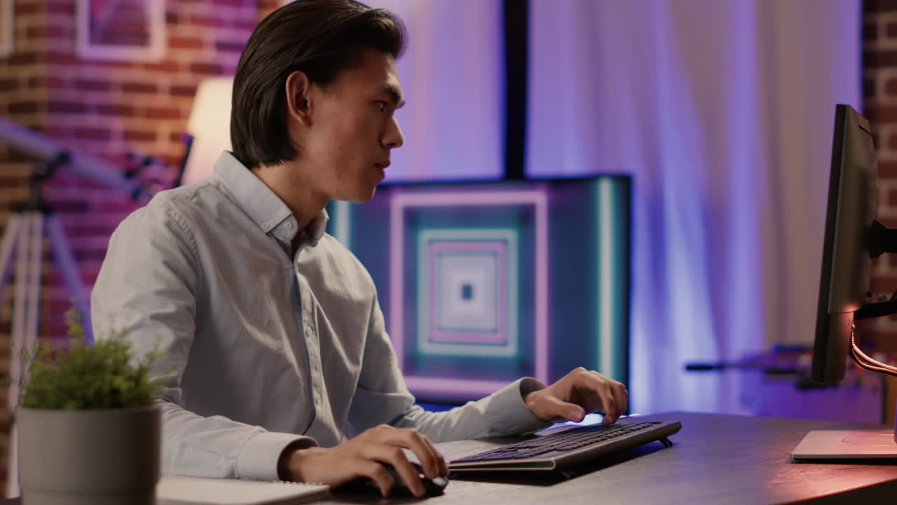 Man working at computer desk in office