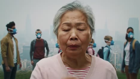 an elderly woman stands amidst a diverse group of people wearing masks against a backdrop of a hazy cityscape, evoking themes of health, community, and resilience in uncertain times