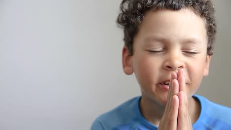 little boy praying to god with hands together stock video