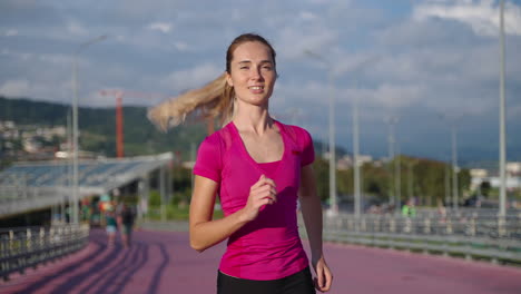 woman running on a city bridge