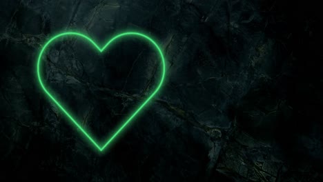 animation of green neon heart flashing on dark wall