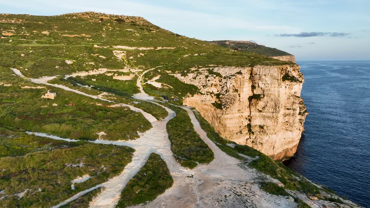 Dynamic drone footage of Migra l-Ferha’s rugged cliff edge and intersecting countryside paths. Showcases Malta’s dramatic limestone formations and the sweeping blue expanse of the Mediterranean Sea.