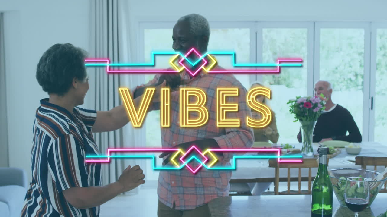 Neon vibes text against african american senior couple dancing together at home
