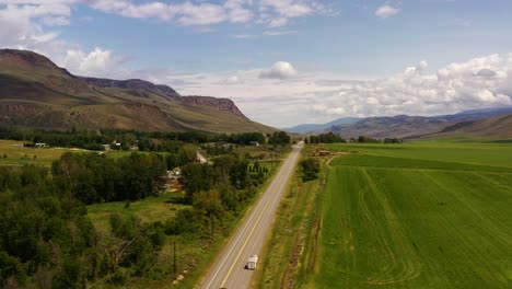 in harmony with nature: drone perspective of agricultural fields blending into the rustic, earth-toned wilderness of cache creek