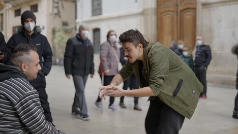 street magician performing card tricks