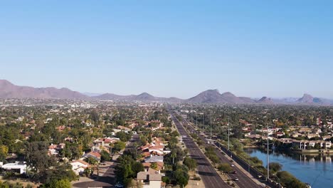 city suburbs in desert landscape of scottsdale, arizona - aerial establishing with copy space in the sky