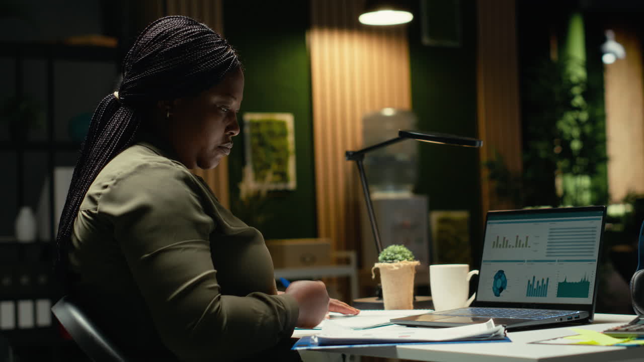 African american analyst reading emails and managing administrative tasks