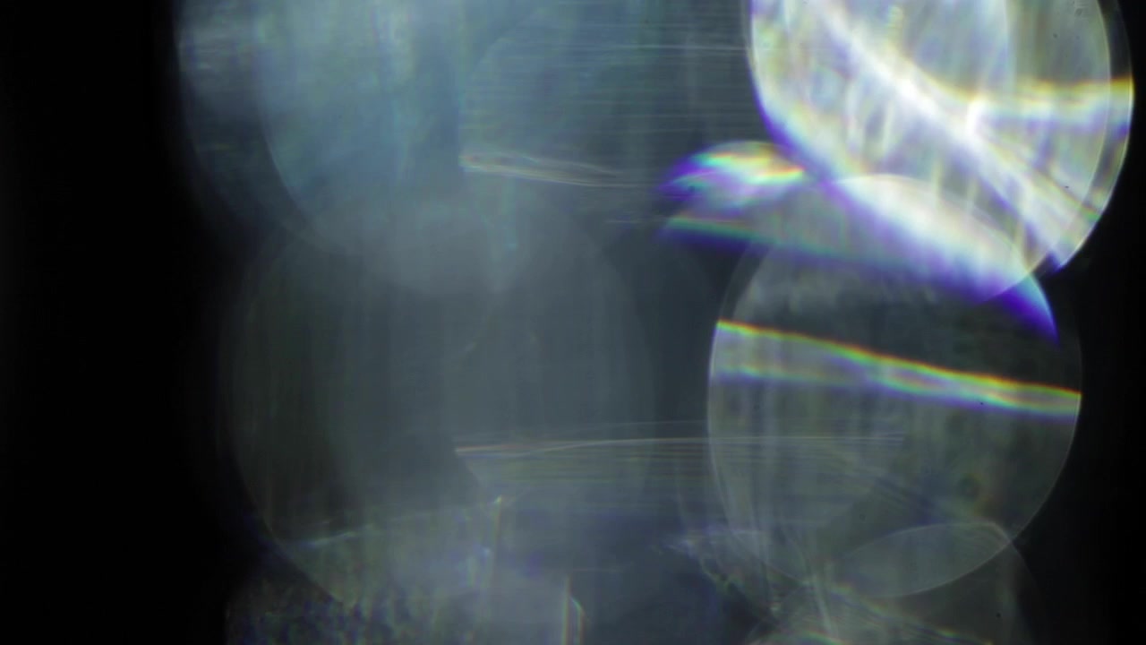 Abstract glass light leaks reflections on black background