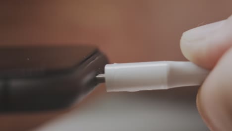 user connects charger to smartphone with low battery