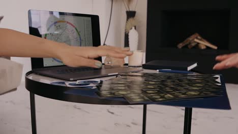 Women-is-analyzing-astronomy-with-tarot-cards,-having-them-lined-up-on-small-table