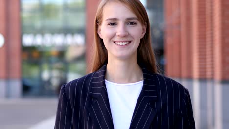 portrait of smiling business woman looking at camera