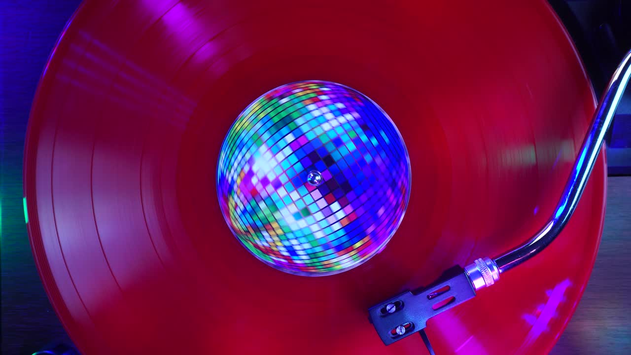 Playback or Red Vinyl Record With Disco Ball Sticker and Party Club Lights, Top Down View