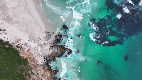 South-Africa-aerial-cinematic-drone-whirlpool-waves-crashing-coastline-Chapman-Peak-Noordhoek-Cape-Town-Hout-Bay-Fish-Hoek-Good-Hope-Simon's-Town-stunning-aqua-deep-blue-water-rugged-rock-looking-down