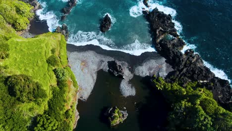 volcanic beach and iconic venus pool in hawaii, aerial drone view