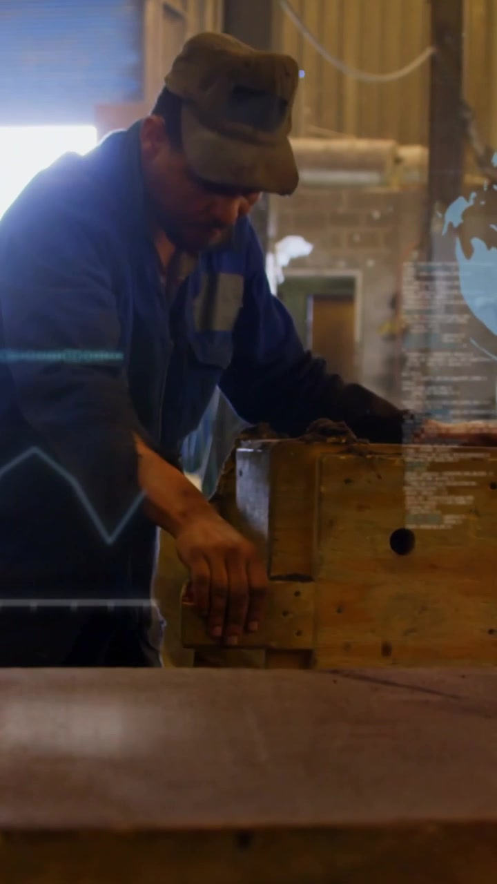 Vertical video: Man after check sliding and holding block to align in shop hovering bars globe code