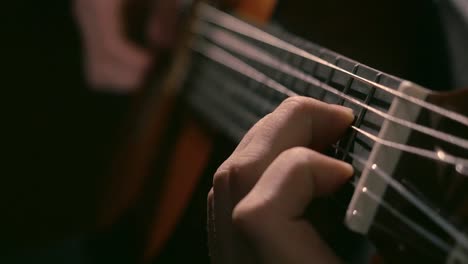 person playing classical guitar