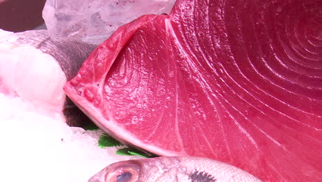 fresh tuna slices at market