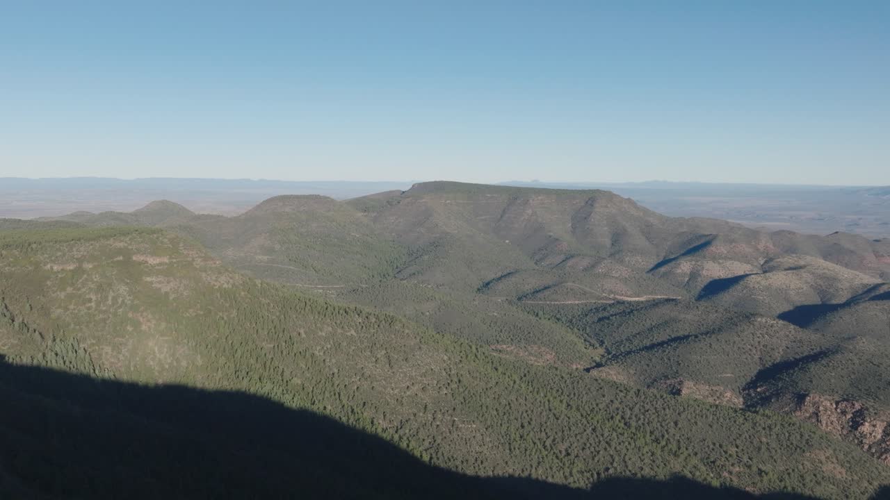 Aerial Drone View of Mingus Mountain Forest Shadow and Distant Table Top Mesas in Arizona Wilderness