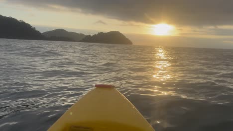 a drifting kayak at sunset