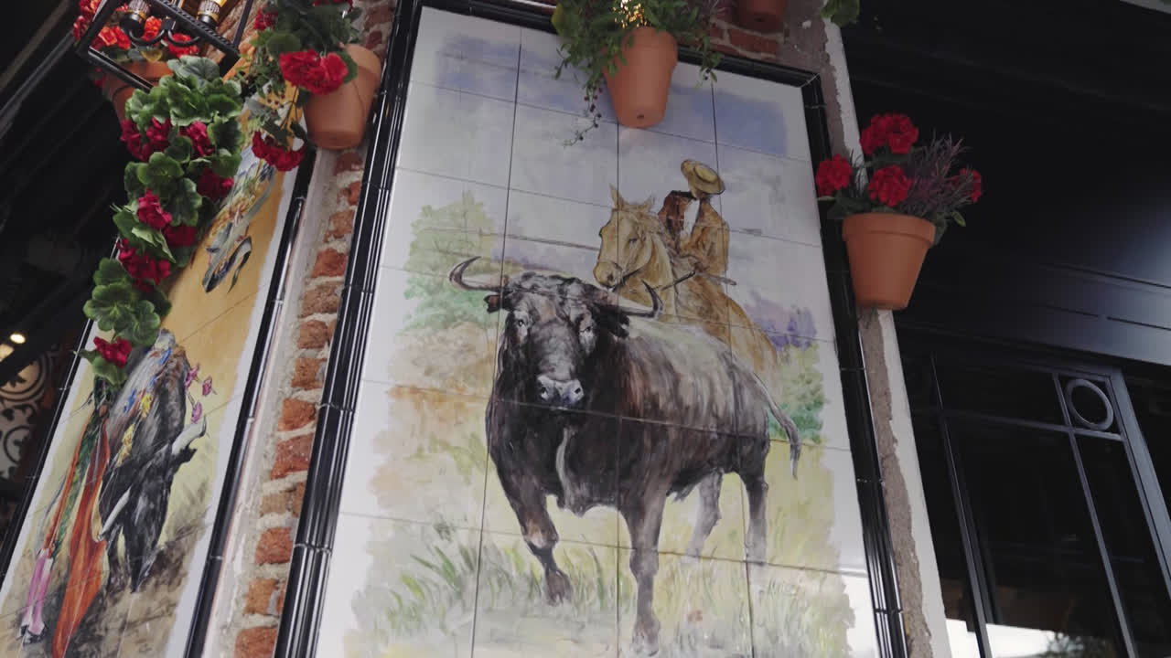 Beautiful slow motion zoom in shot of a handmade bull painting in a restaurant outside the Las Ventas bullring in Madrid, Spain.