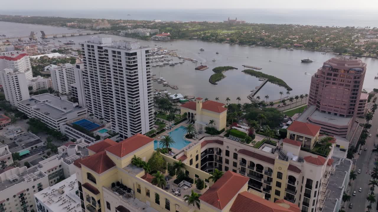 Aerial View of a Luxurious Waterfront Cityscape with Marina and Resort Buildings