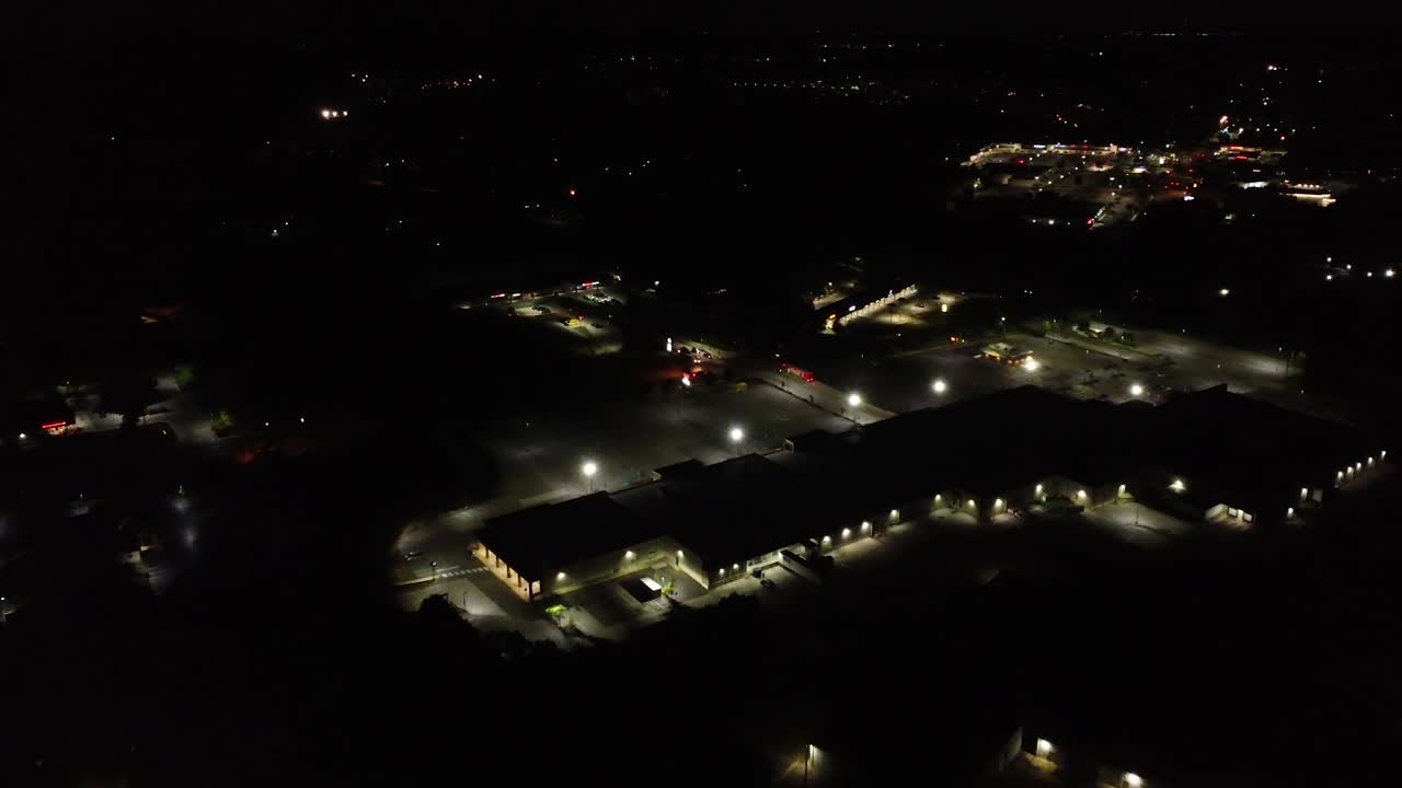 night fly over commercial buildings