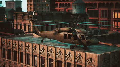 military helicopter on rooftop of city buildings